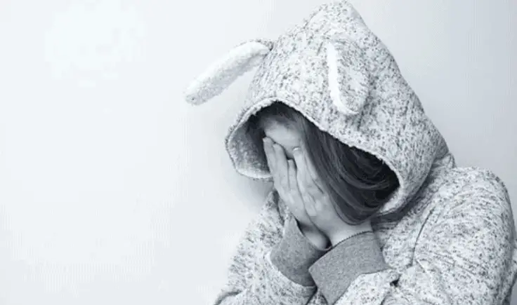 Sad woman in a hoodie